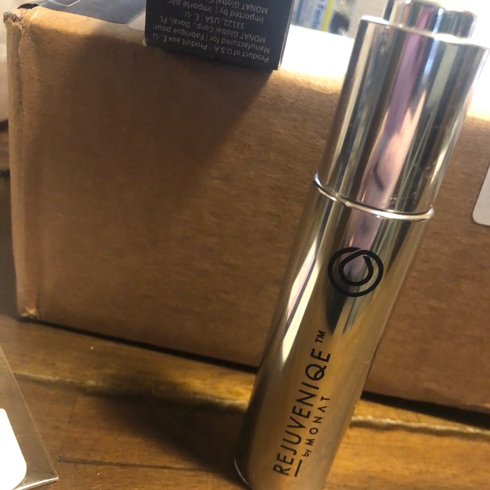 OPEN bottle of MONAT Rejuveniqe oil intensive